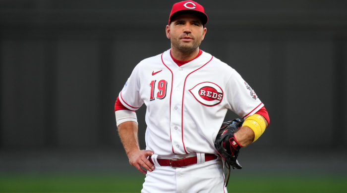 Reds first baseman Joey Votto looks on with his hands on his hips during a game.